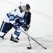 Pioneer senior Louis Marr competes for a loose puck around center ice in the game against Livonia Stevenson on Tuesday, March 5. Daniel Brenner I AnnArbor.com